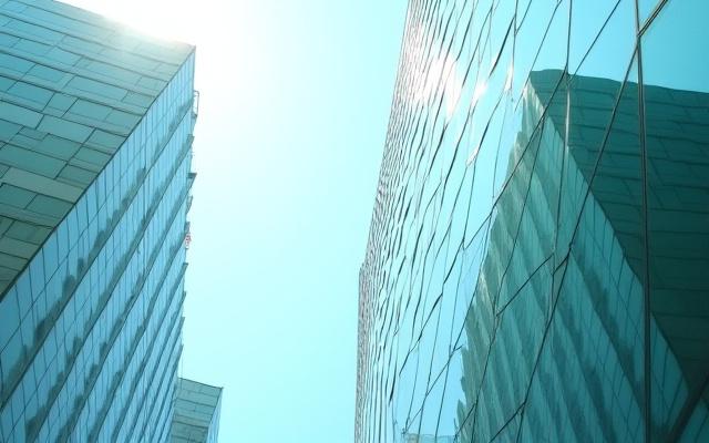 Modern architectural lines and reflections in Kita Ward, Osaka, during daytime.
